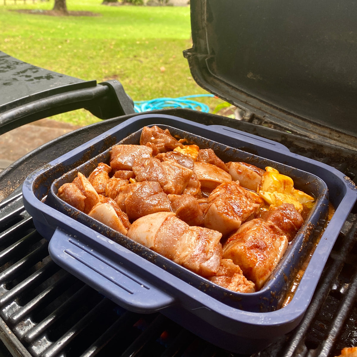 Flat Stacks Ovenware with marinated chicken on a BBQ hot plate